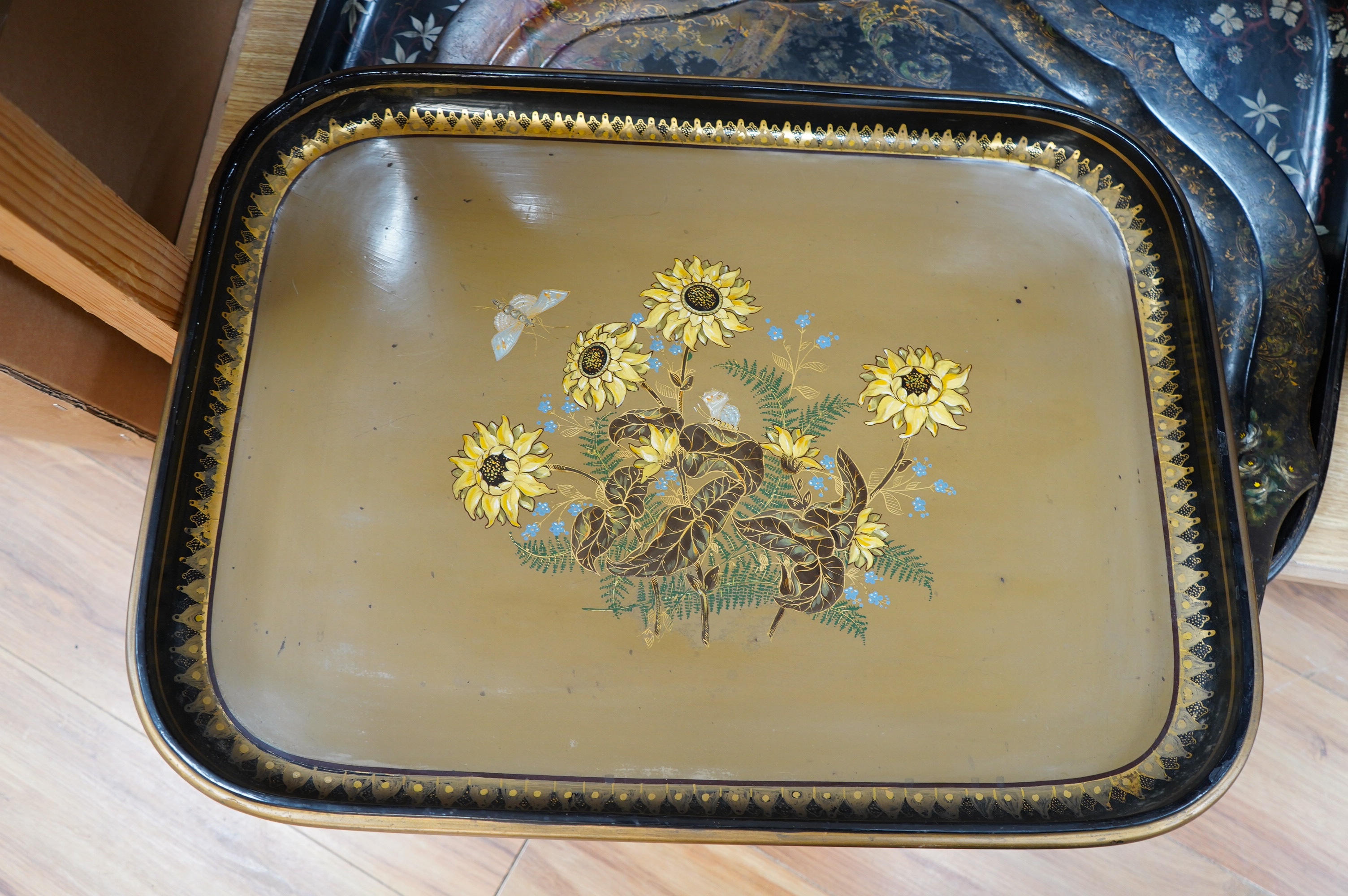 Three large Victorian papier mâché trays, largest 71cm wide. Condition - all have faults